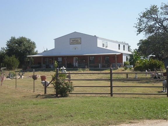 Front view of large facility from the Highway.