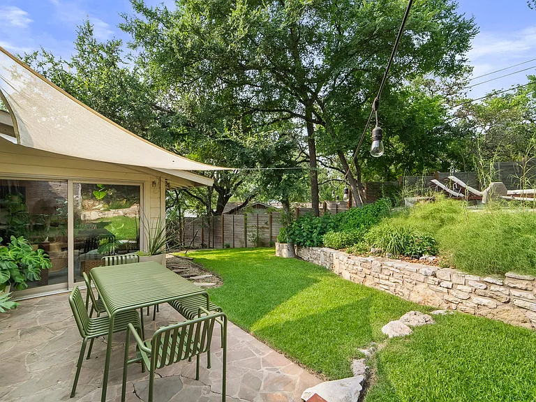 Back yard. Has sprinkler system.