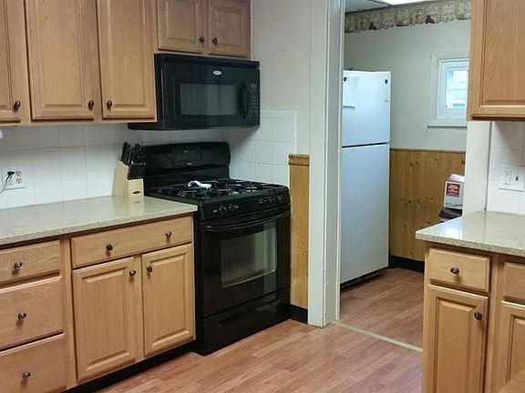 Beautiful cabinets, granite countertops,  oven and microwave approx. 5 year old.  Refrigerator in nice sized pantry.