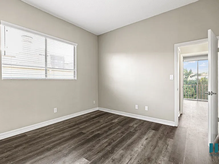 Bedroom with Large Windows and Vinyl Flooring