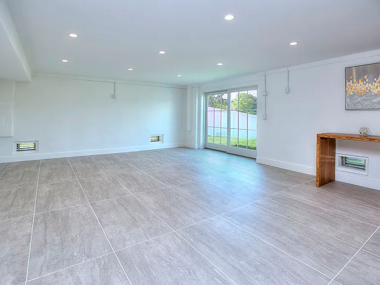 Walk out to the back yard from the ground level bonus room.