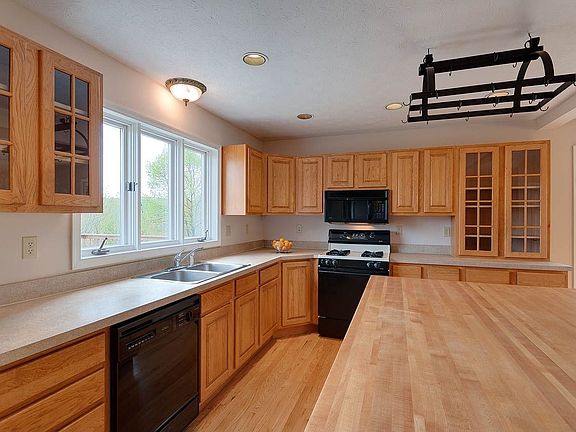 Huge kitchen with an island big enough for many and lots of counter space