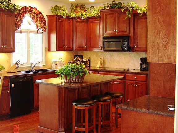 Kitchen w/ Cherry cabinets, granite, island, dbl oven, pantry 