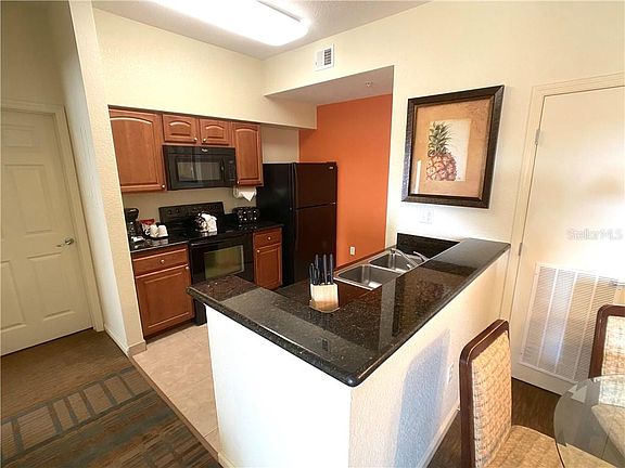 5th image of 8125 Resort Village Dr