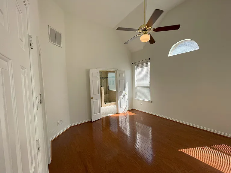 Master bedroom with high ceiling with two large walk-in closets