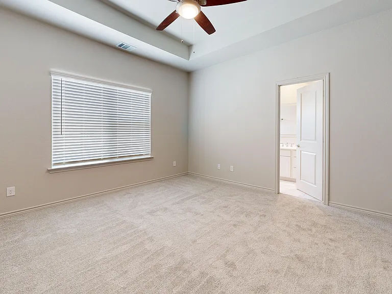 Primary Bedroom with Tray Ceiling and Ensuite