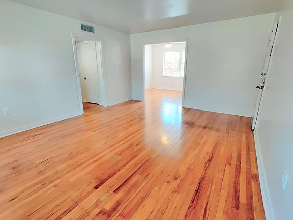 Living room with dining room in background