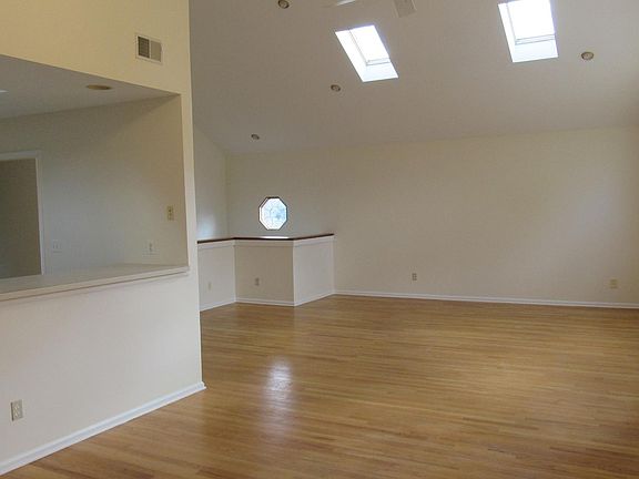 Dining room looking into kitchen and living room