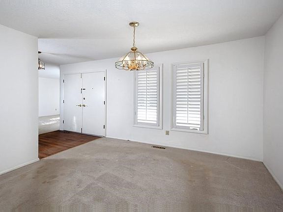 Dining room also features plantation shutters.