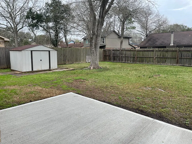 Large backyard with storage shed