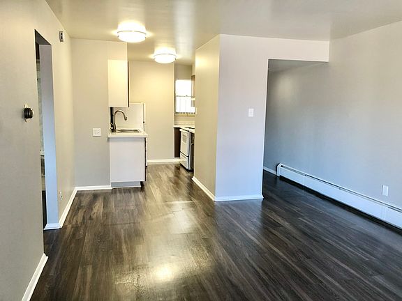 Immerse yourself in this sleek apartment featuring a modern kitchen and open living space. Immerse yourself in this sleek apartment featuring a modern kitchen and open living space.