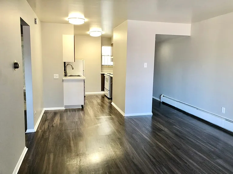 Immerse yourself in this sleek apartment featuring a modern kitchen and open living space. Immerse yourself in this sleek apartment featuring a modern kitchen and open living space.