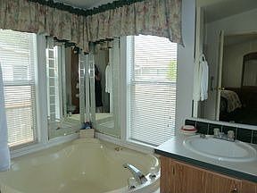 (MST BA. DOUBLE SINKS FLOOR TO CEILING TOWEL CABINETAdd Caption)