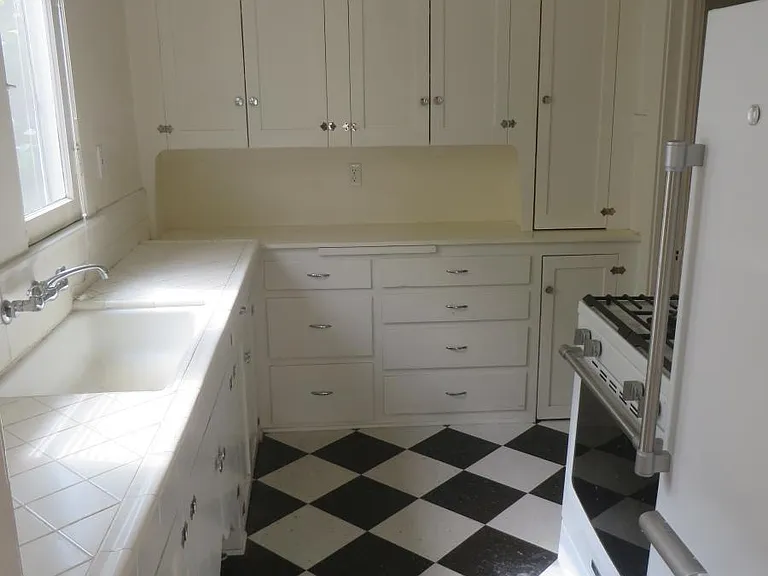 Kitchen with newer Maytag refrigerator and range