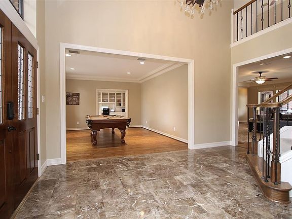 Elegant grand entrance foyer with the formal living to the left.