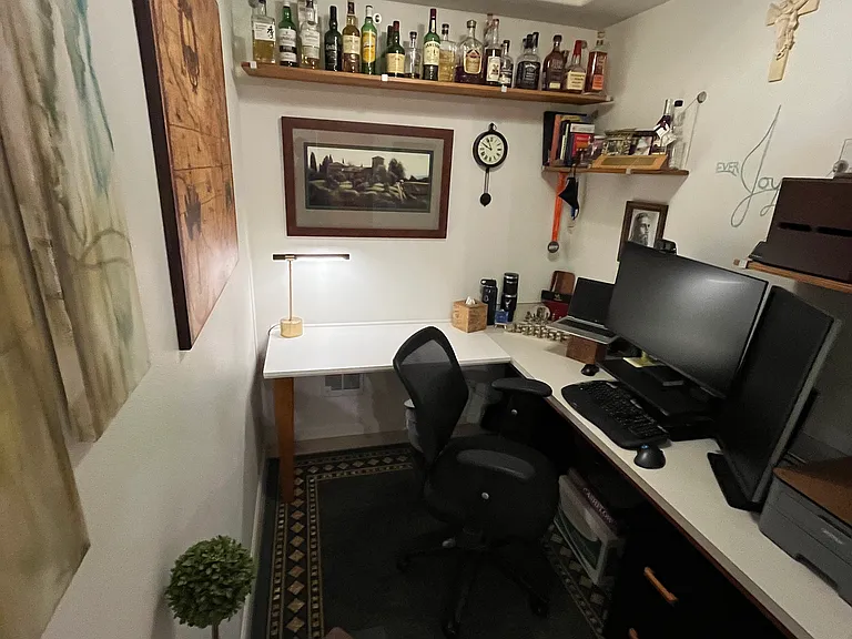 Third space just off the kitchen used as office with built-in extended desk