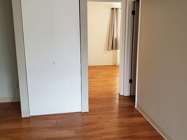 Coat closet, bedroom door and bathroom door