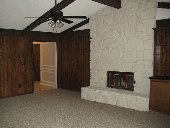Family Room with woodburning fireplace with gas starter