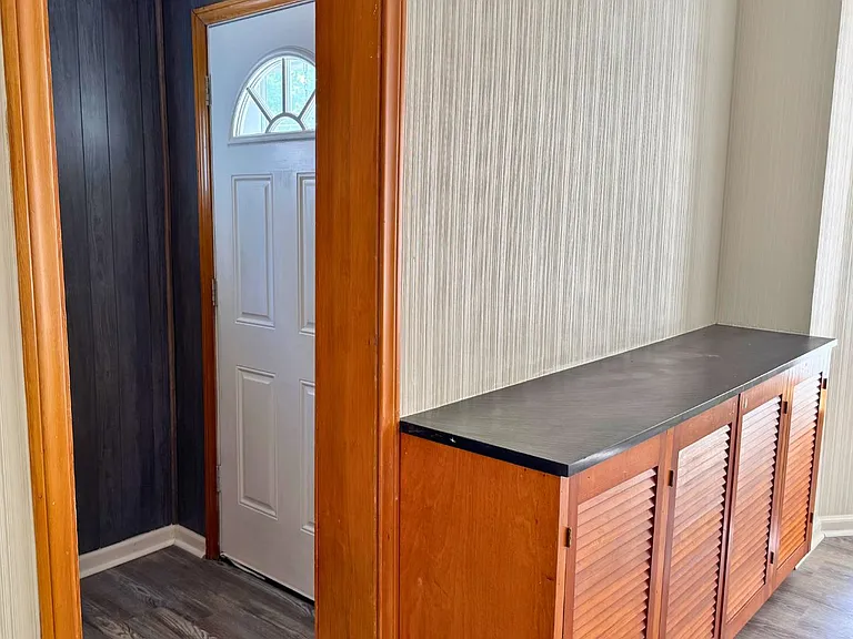 Entry way to the living room with built-in cabinetry