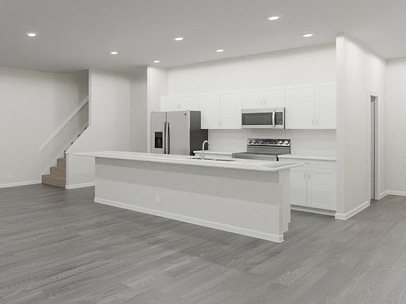 Enjoy a spacious, open living area and kitchen with beautiful finishes. Artist s rendering