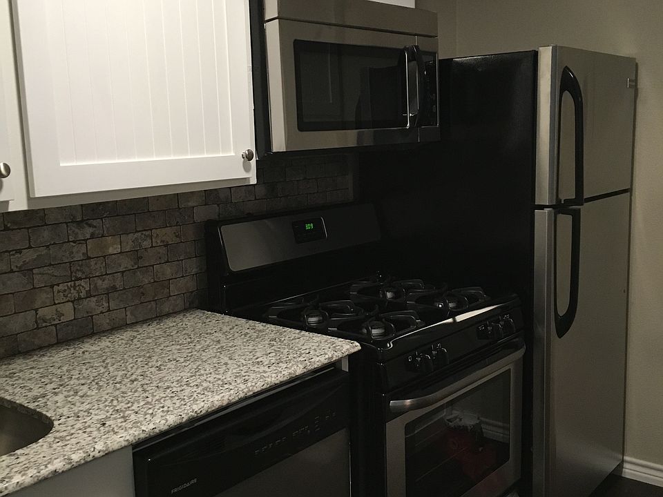 Beautiful kitchen with stainless steel appliances (gas range