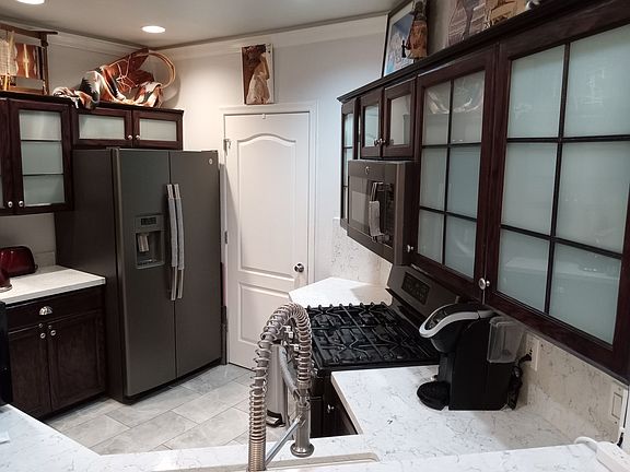 All kitchen accessories are available in this rental. Also pictured is door to the convenient laundry room.