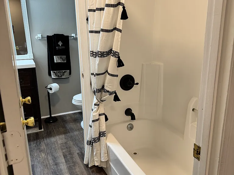 Hollywood bathroom with dual access off master bedroom and hallway.