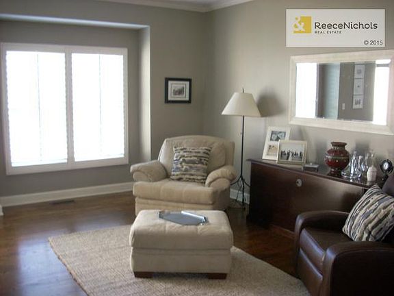 Formal Living with hardwood floors and Planation Shutters