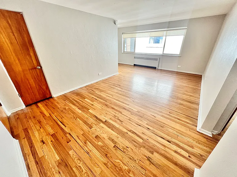 Experience the warmth and elegance of this open living area with stunning hardwood floors. Experience the warmth and elegance of this open living area with stunning hardwood floors.