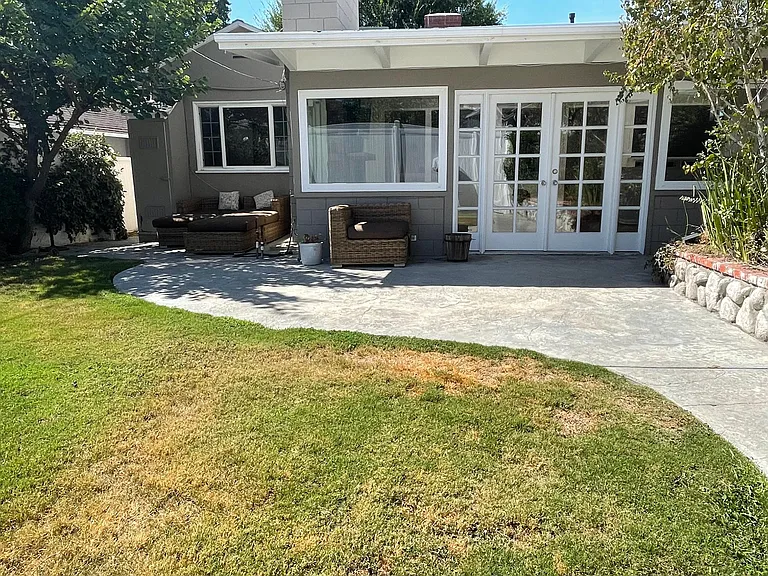 Enclosed backyard with BBQ