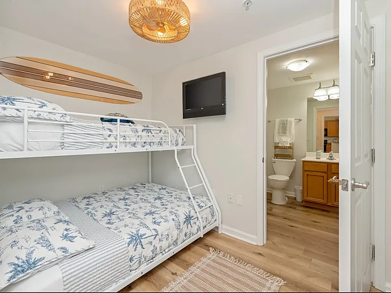 The bunk bed has been UPGRADED from the one that is pictured *New Pics Coming Soon* They are both FULL SIZE mattresses. Smart Roku TV is also upgraded in this room