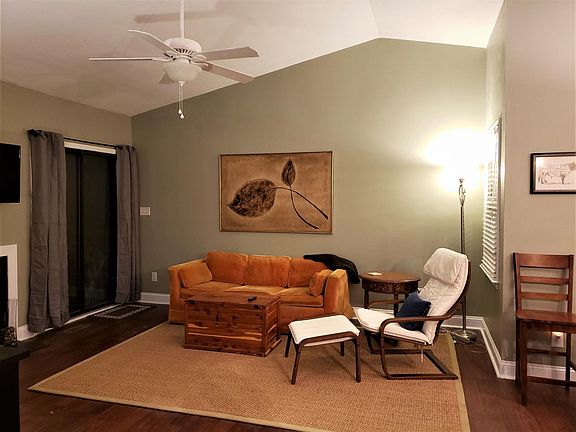 Living Room with a sliding glass door leading to the back deck and yard