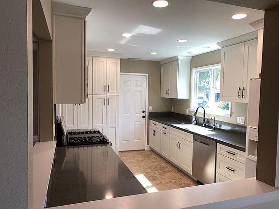 Brand new kitchen exits to garage.