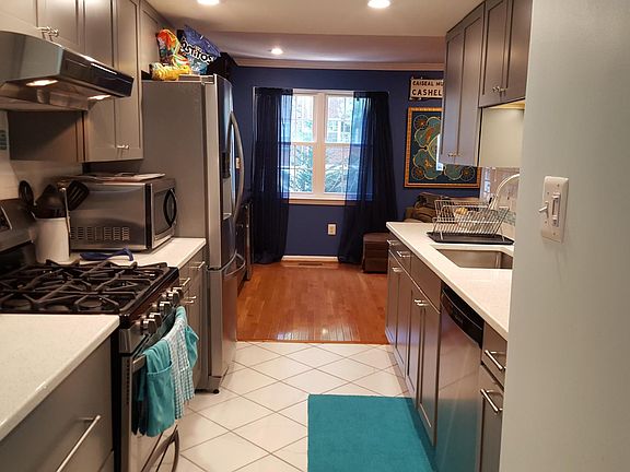 Renovated kitchen features quartz counter tops, stainless st