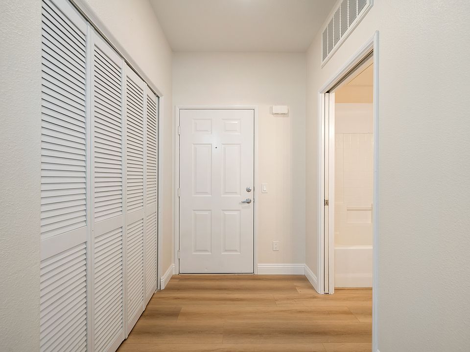 Entry to unit, doors on left are to laundry area