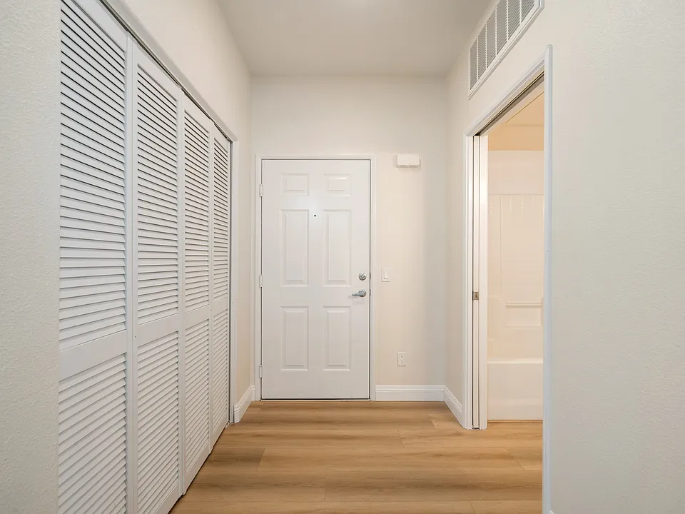 Entry to unit, doors on left are to laundry area