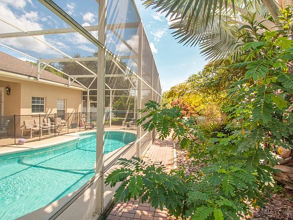 You'll enjoy the paved garden walking path around the pool.