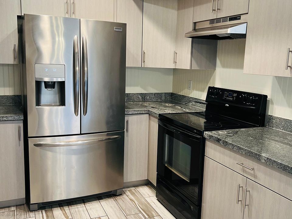 Beautiful kitchen-fully upgraded with French door refrigerator, granite counters, TONS of cabinet space, dishwasher and flat top electric stove. Range vent, LED recessed lighting.