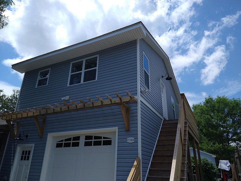 2nd floor apartment, accessed from driveway/front of property, features a 2-way light switch and doorbell at driveway level