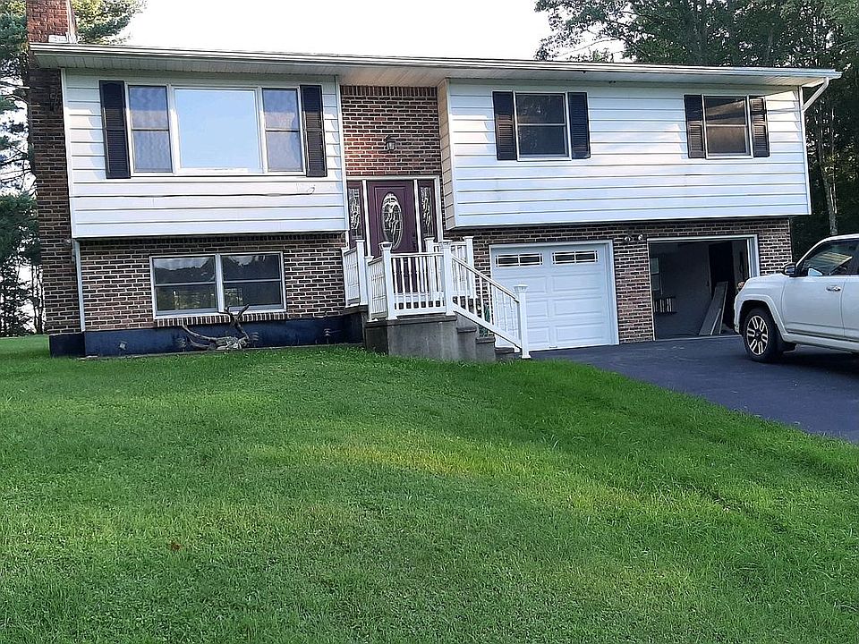 Front view with 2 car garage