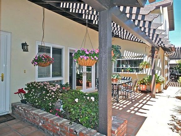 Flowerbeds lined with used brick