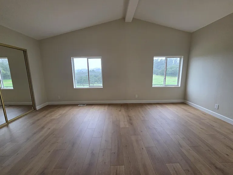 Master bedroom with vaulted ceiling
