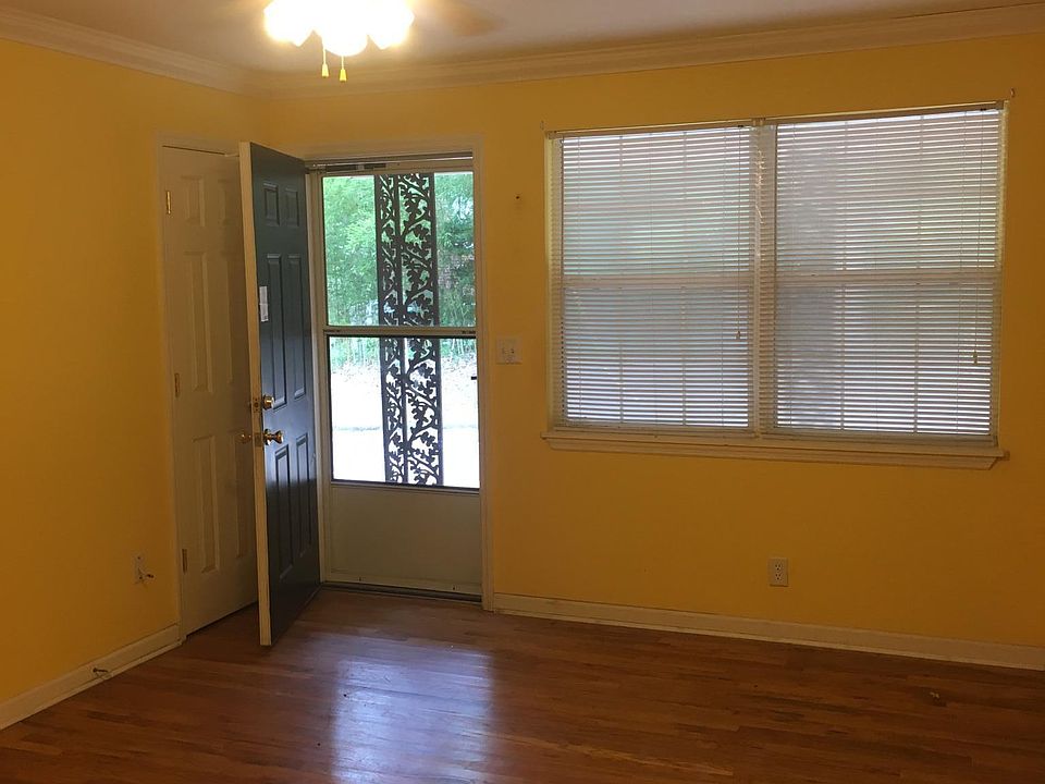 Front Entry Door to Great Room and Double Window, Porch Light and Electrical Outlet on Porch