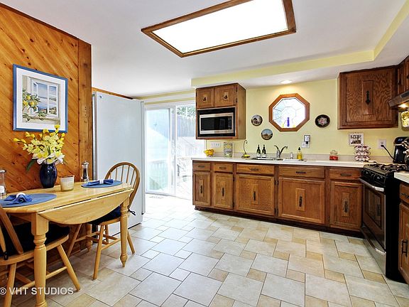 Kitchen features a pantry closet, table space, new Stove in 2016. Patio doors lead out to your own p