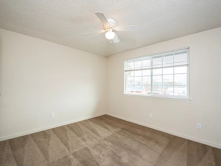 Experience the serenity of this bright, spacious bedroom featuring a large window. Experience the serenity of this bright, spacious bedroom featuring a large window.