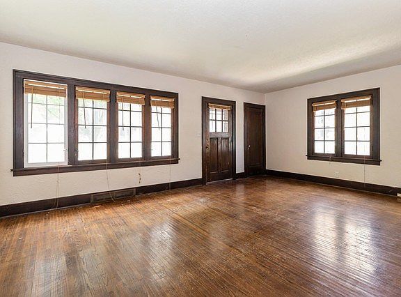~Large living room full of natural light and Hardwood floors.