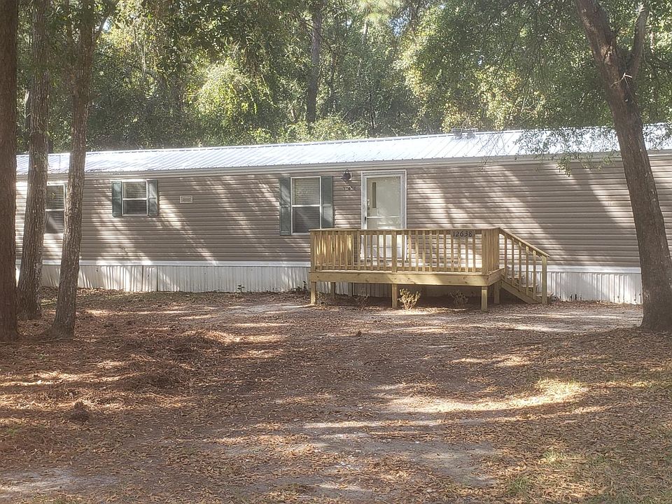 Large, shady yard with new deck at front door