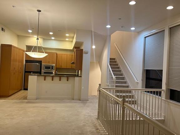 Main Floor - Great Room, Den, Kitchen, Hall Bath, Laundary Room, Big Tall Windows, 2 Balconies...