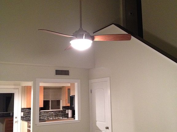 Vaulted living area with concrete floors.