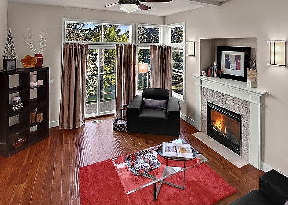 The living room is light and airy, with an outdoor deck and fireplace.